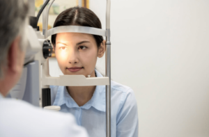 A woman at an optometrist office getting her eyes examined