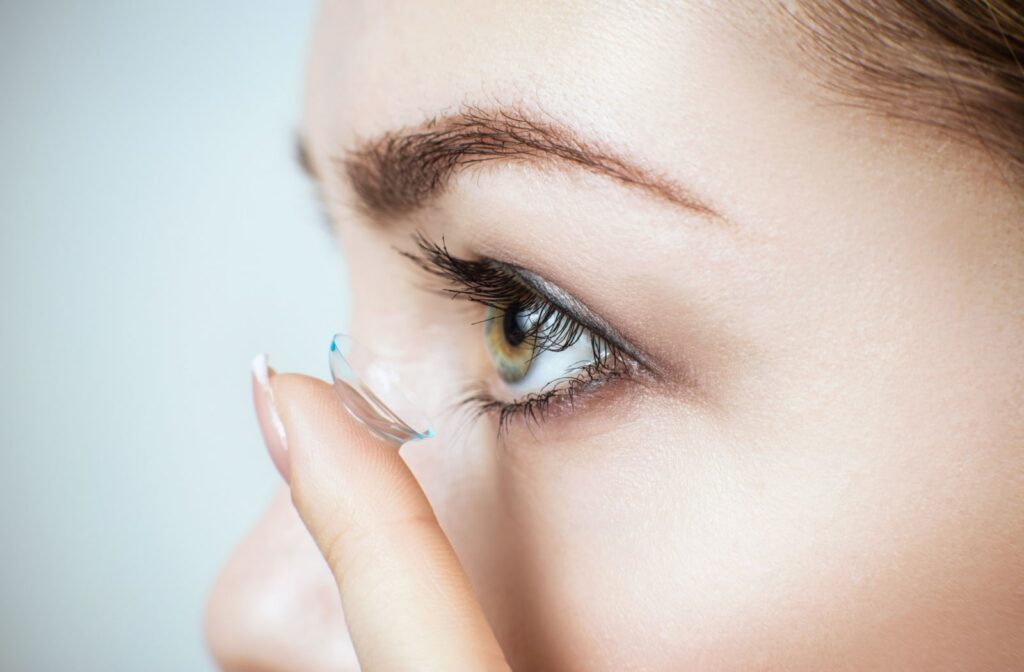 A detailed shot of a woman using contact lenses. Scleral lenses can be a beneficial choice for individuals experiencing dry eyes.
