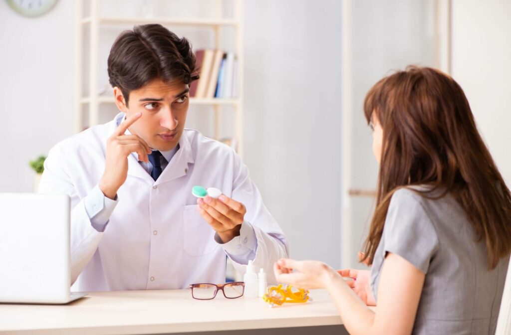 An eye doctor discusses contact lens options with a patient